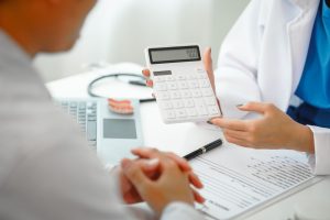 doctor-explains-costs-to-patient-at-workplace-2026-03-24-05-03-32-utc (1)
